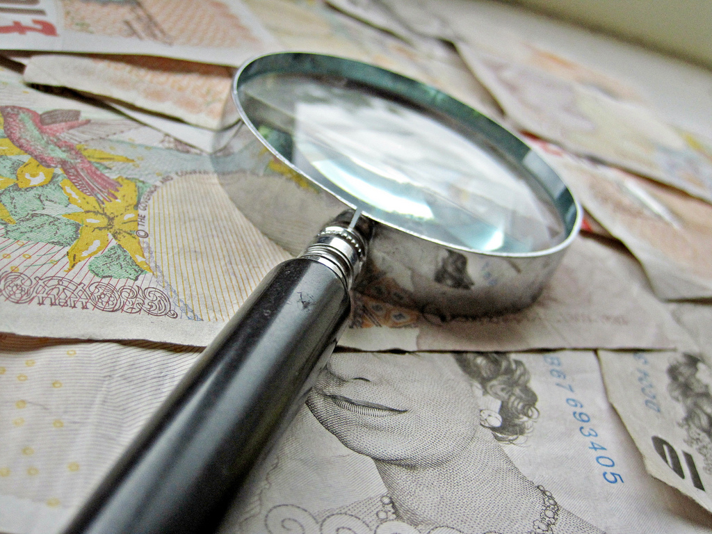 costs assessment money magnifying glass